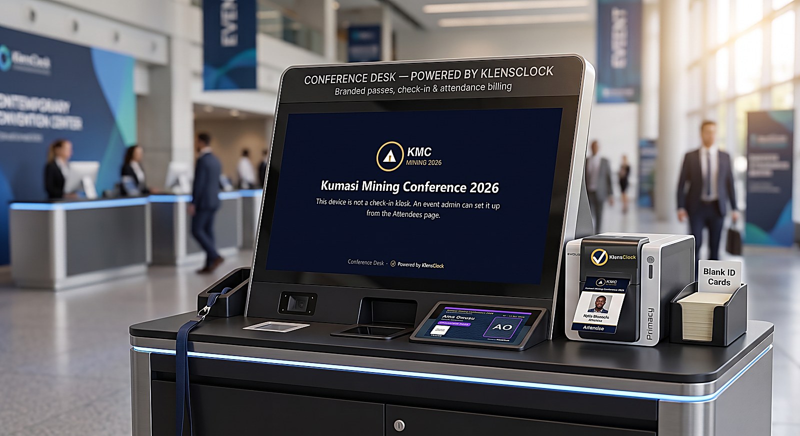 A Conference Desk check-in kiosk branded for an event, with a pass printer and blank cards, Powered by KlensClock